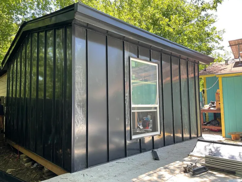 Black standing seam metal wall panels for Roof Inspection in Merrimack