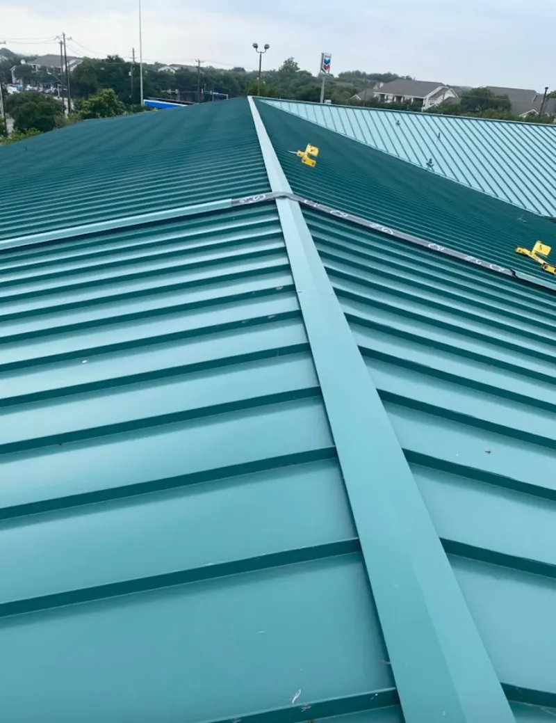 Green commercial metal roof ridge and valley for Metal Roof Repair in Merrimack